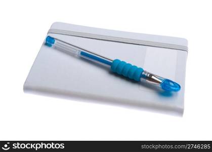 grey notebook diary or agenda and blue pen lying on the top (isolated on white background)