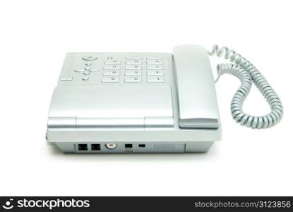 grey office telephone on a white background