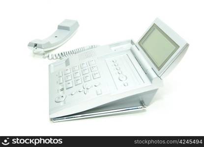 grey office telephone on a white background