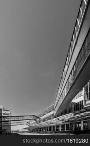 Grey scale shot of the facade of the Van Nelle factory in Rotterdam, the Netherlands