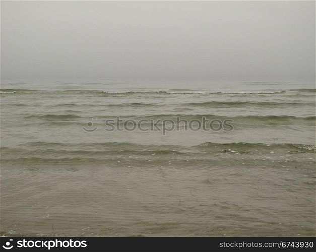 grey seascape. grey seascape with fog and waves in the baltic sea