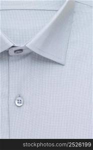 grey shirt, detailed close-up collar and button, top view. shirt, top view