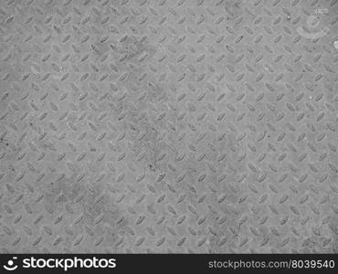 Grey steel diamond plate background. Grey steel diamond plate useful as a background in black and white