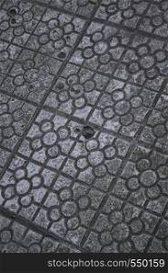 grey tiled pavement in the street in the city
