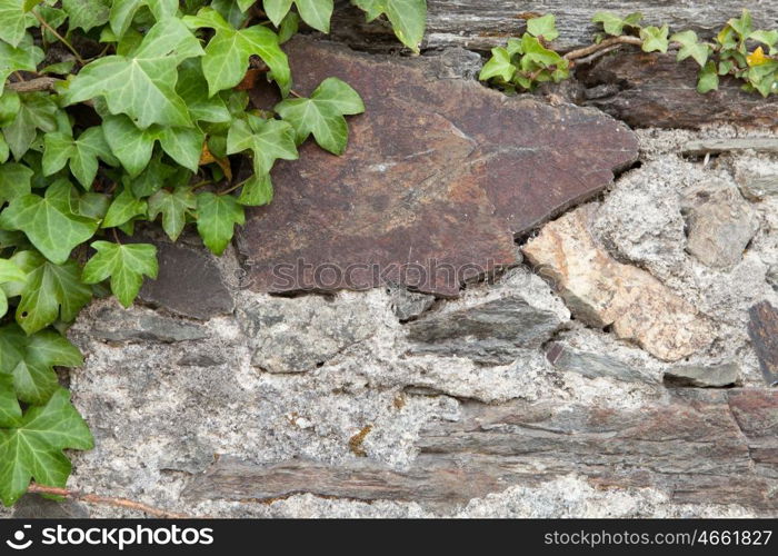 Grey wall of stone damaged by the passage of time