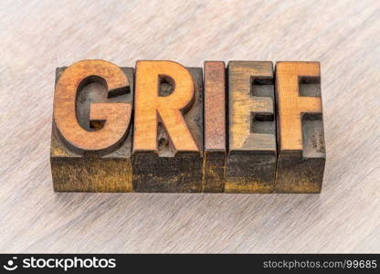 grief word abstract in vintage letterpress wood type