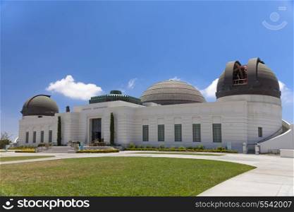 Griffith observatory with green grass field and sunny day&#xA;