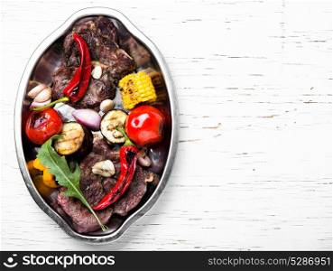 Grill meat and vegetables. Beef barbecue meat, grilled vegetables on tray.Background food