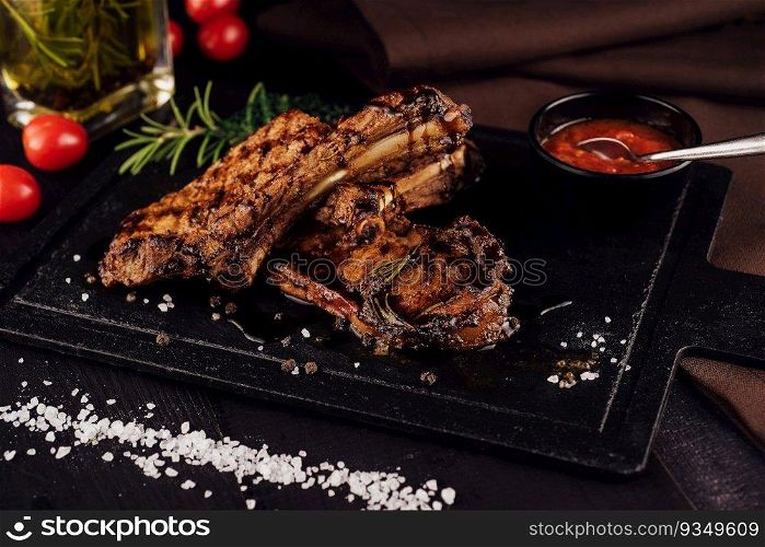 Grilled and barbecue ribs pork on black