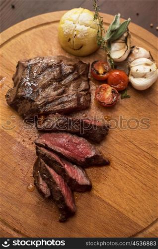 grilled beef steak. grilled beef steak with herbs and vegetables