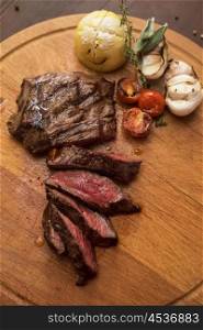 grilled beef steak. grilled beef steak with herbs and vegetables
