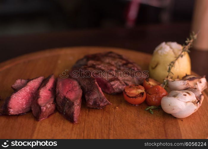 grilled beef steak. grilled beef steak with herbs and vegetables