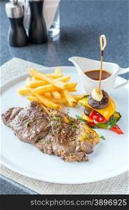 Grilled beef steak with french fried and baked vegetable