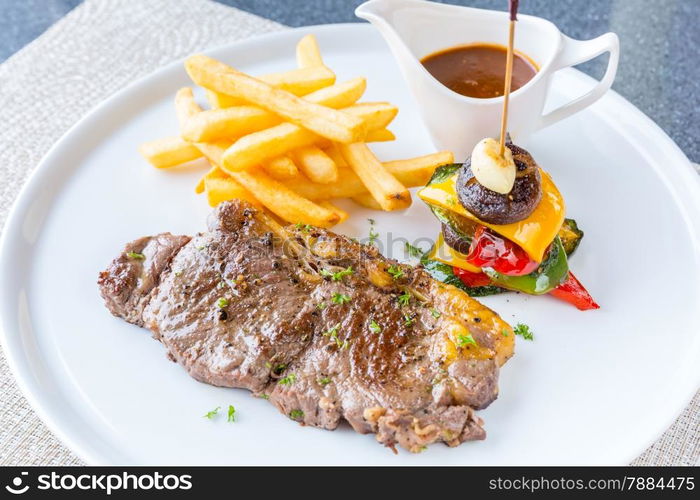 Grilled beef steak with french fried and baked vegetable