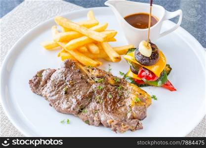 Grilled beef steak with french fried and baked vegetable