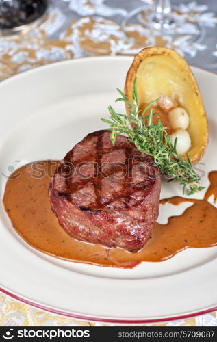 grilled beef steak with herbs and vegetables