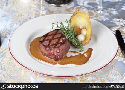 grilled beef steak with herbs and vegetables. beef steak