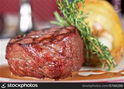 grilled beef steak with herbs and vegetables. beef steak