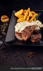 Grilled Beef Steaks with Mushroom Sauce and french fries