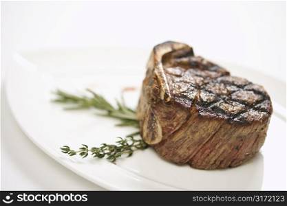 Grilled beef tenderloin on plate.