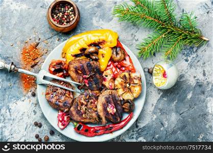 Grilled beef with vegetables to the Christmas table.Veal in pomegranate sauce.Christmas dinner. Christmas roast meat