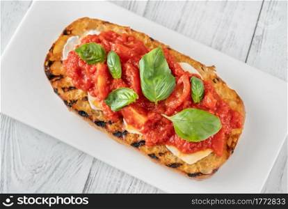Grilled bread with mozzarella and pureed tomatoes