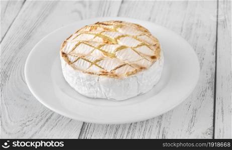 Grilled Camembert cheese on the serving plate