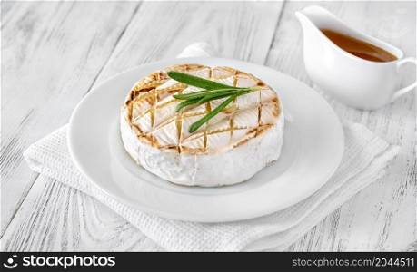 Grilled Camembert cheese on the serving plate
