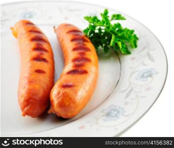 grilled cheese sausages on white background