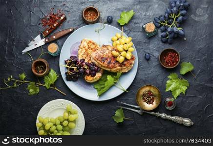 Grilled chicken breast marinated in grape sauce.Chicken fillets on slate concrete background. Grilled chicken breast