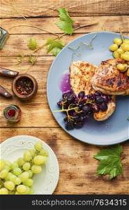 Grilled chicken breast marinated in grape sauce. Grilled chicken breast