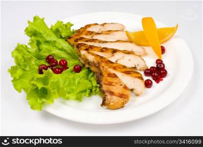 grilled chicken breast, served with cranberries and oranges
