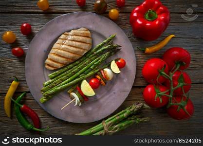 grilled chicken breast with brochette vegetable. grilled chicken breast with brochette vegetable with grill asparagus