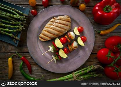 grilled chicken breast with brochette vegetable. grilled chicken breast with brochette vegetable with grill asparagus