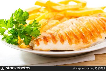 Grilled chicken breast with fries