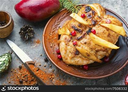 Grilled chicken breast with mango.Christmas baked chicken. Fried chicken with mango