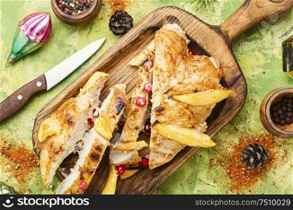 Grilled chicken breast with mango.Christmas baked chicken. Sliced grilled chicken breast