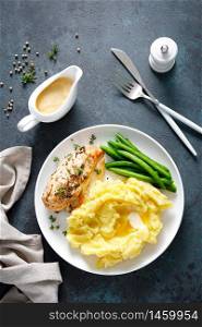 Grilled chicken breast with mashed potatoes and green beans