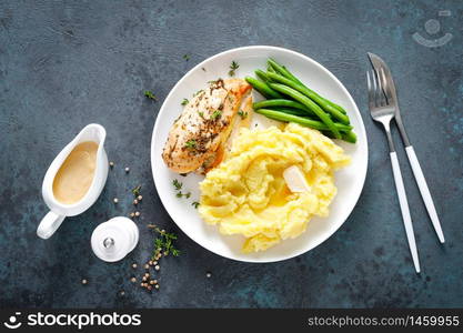 Grilled chicken breast with mashed potatoes and green beans