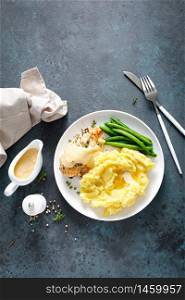 Grilled chicken breast with mashed potatoes and green beans