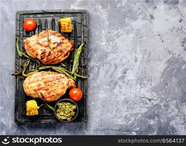 Grilled chicken breast with vegetable on kitchen board.Healthy food. Grilled healthy chicken breasts
