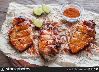 Grilled chicken breasts in hot mango sauce