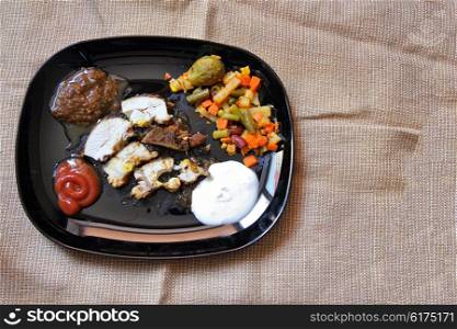 Grilled chicken fillet, breast with cooked vegetable on plate