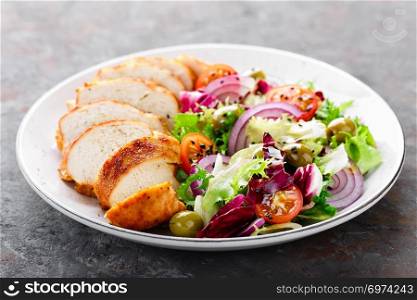 Grilled chicken meat, breast, fillet and fresh vegetable salad