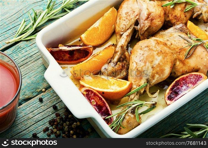 Grilled chicken meat with orange sauce and rosemary.Homemade food. Roasted chicken with oranges
