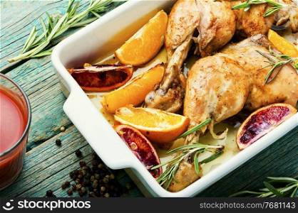 Grilled chicken meat with orange sauce and rosemary.Homemade food. Roasted chicken with oranges