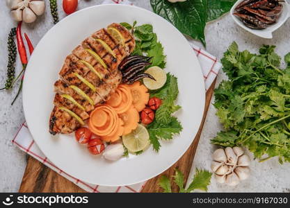 Grilled chicken pieces with tomatoes, carrots, fried peppers, red onion, cucumber,  and mint.