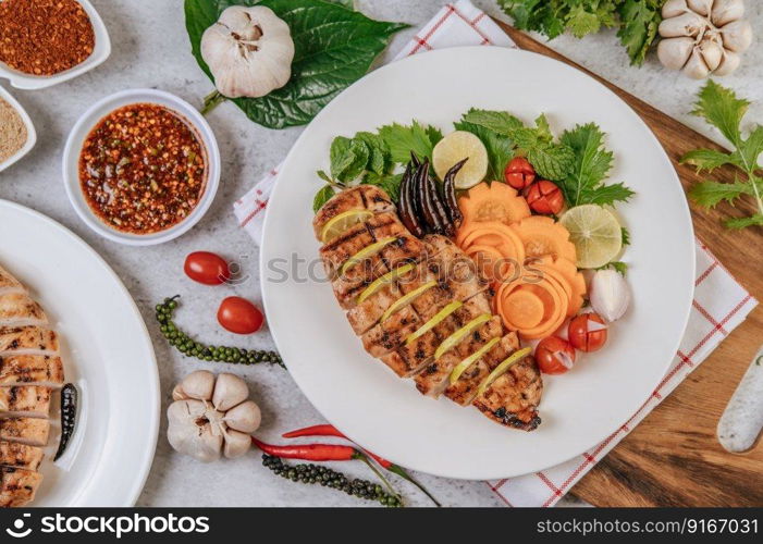 Grilled chicken pieces with tomatoes, carrots, fried peppers, red onion, cucumber,  and mint.