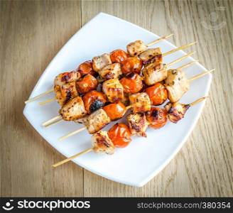 Grilled chicken skewers with cherry tomatoes