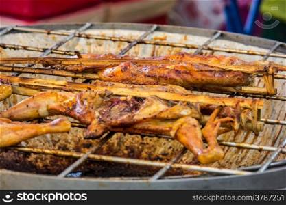 grilled chicken sold by street food vendor